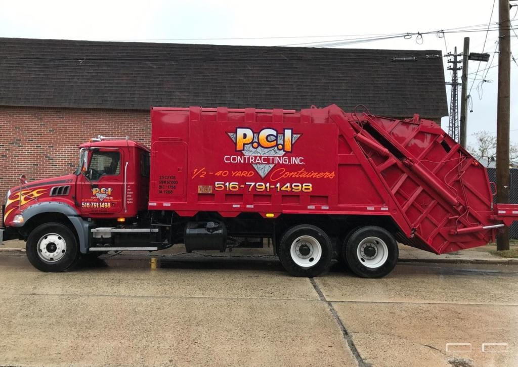 Close-up of a roll-off dumpster with a price tag, illustrating pricing options for dumpster rentals