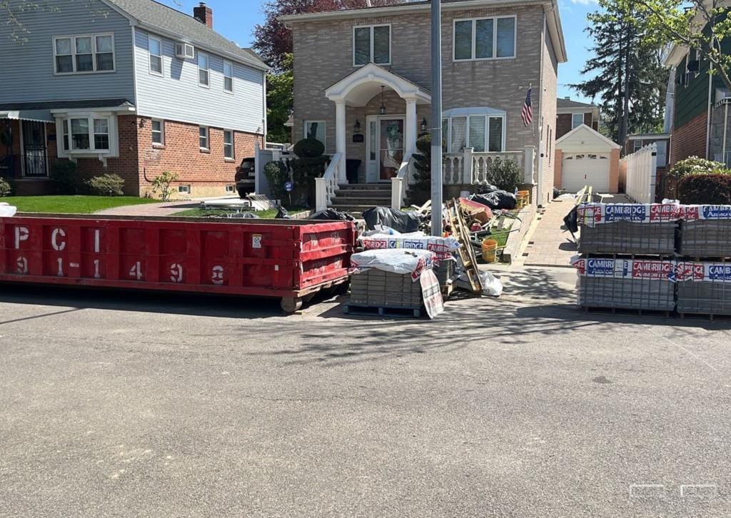 Homeowner and construction manager benefiting from 10 yard dumpster for residential and commercial projects